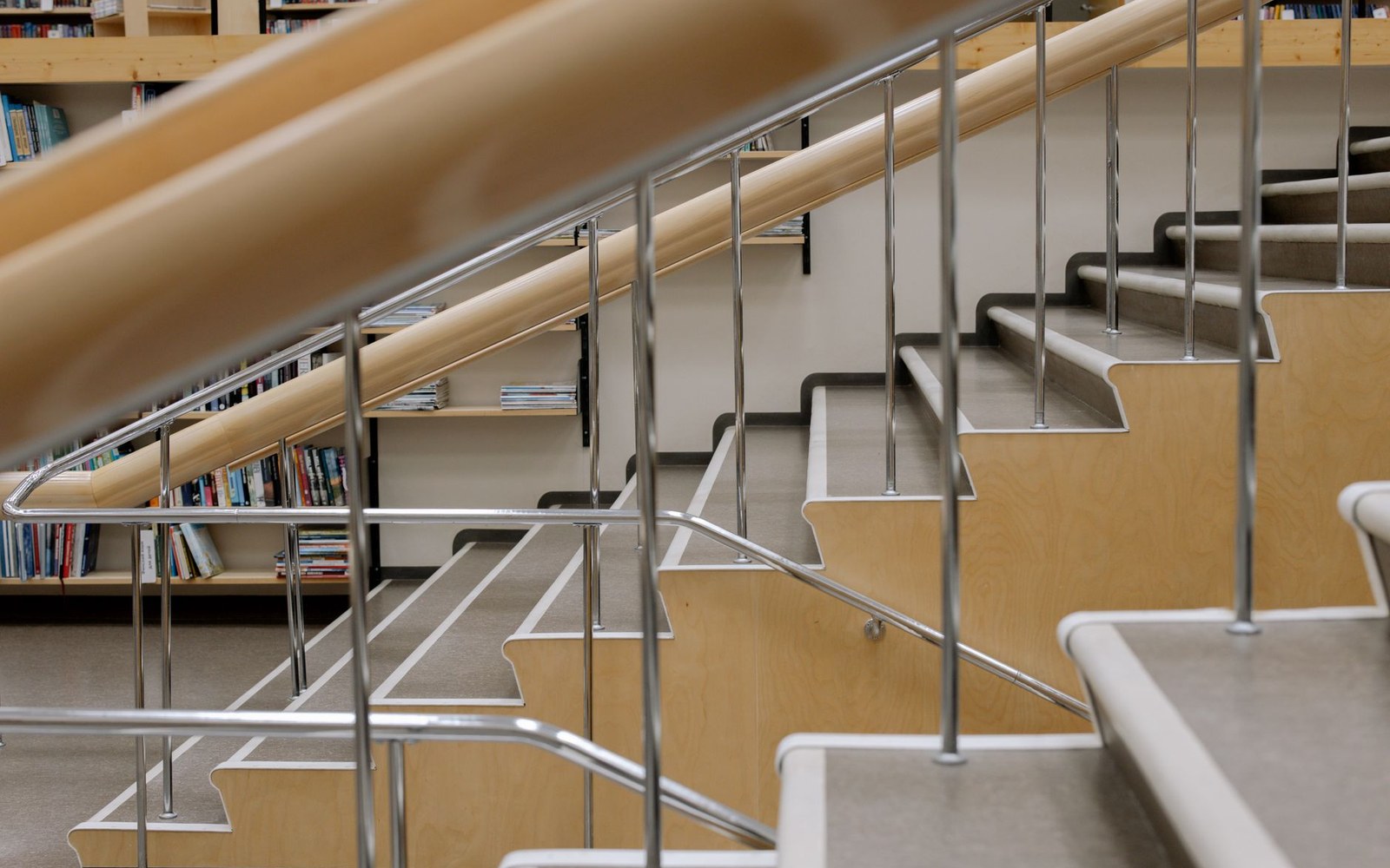 A stair hall with a handrail worn smooth